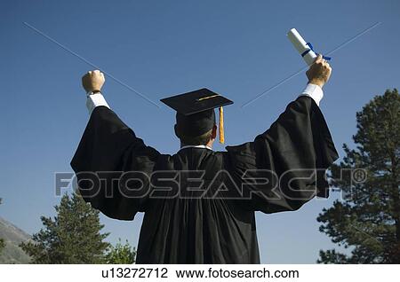 Male graduate cheering View Large Photo Image Stock Image - Male graduate cheering. Fotosearch