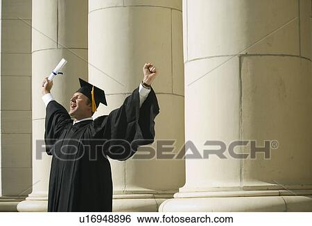 Stock Photograph - Male graduate cheering. Fotosearch