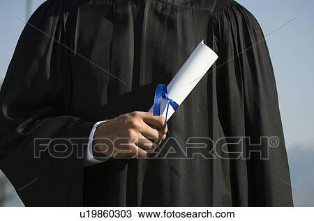 Male graduate holding diploma View Large Photo Image Stock Image - Male graduate holding diploma. Fotosearch