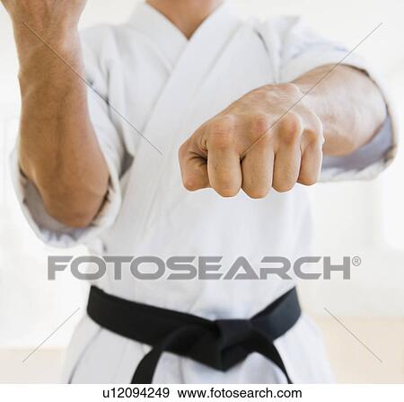 Male karate black belt in fighting stance View Large Photo Image Stock Photo - Male karate black belt in fighting stance. Fotosearch