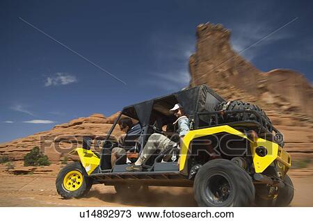 Man driving off-road vehicle in desert View Large Photo Image Stock Image - Man driving off-road vehicle in desert. Fotosearch