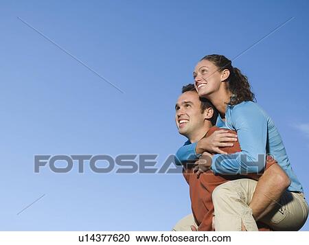 Man giving girlfriend piggy back ride, Utah, United States View Large Photo Image Stock Image - Man giving girlfriend piggy back ride, Utah, United States. Fotosearch