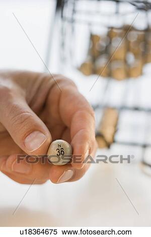 Man holding bingo ball View Large Photo Image Stock Photography - Man holding bingo ball. Fotosearch