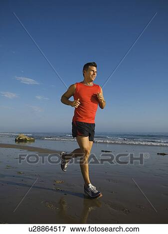Man jogging on beach View Large Photo Image Stock Photo - Man jogging on beach. Fotosearch