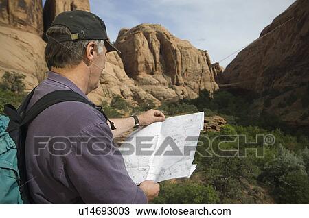 Man looking at map View Large Photo Image Stock Image - Man looking at map. Fotosearch
