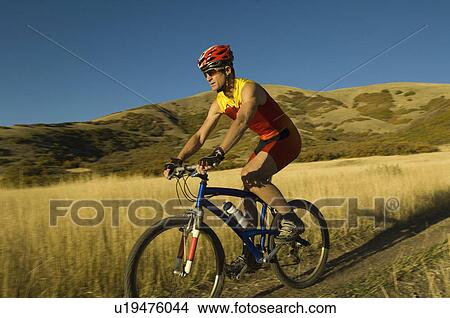 Man riding mountain bike, Salt Flats, Utah, United States View Large Photo Image Picture - Man riding mountain bike, Salt Flats, Utah, United States. Fotosearch