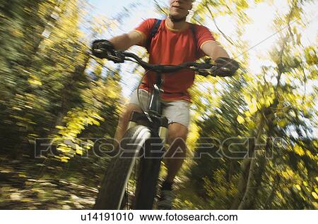 Man riding mountain bike, Utah, United States View Large Photo Image Stock Image - Man riding mountain bike, Utah, United States. Fotosearch