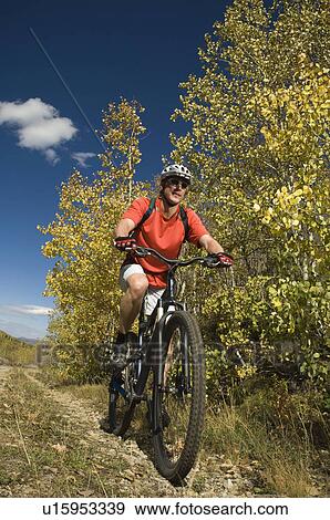 Man riding mountain bike, Utah, United States View Large Photo Image Stock Photo - Man riding mountain bike, Utah, United States. Fotosearch