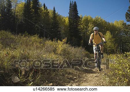 Stock Photography - Man riding mountain bike, Utah, United States. Fotosearch
