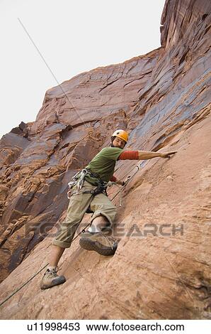 Man rock climbing View Large Photo Image Stock Image - Man rock climbing. Fotosearch