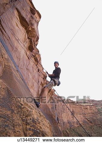 Man rock climbing View Large Photo Image Stock Image - Man rock climbing. Fotosearch