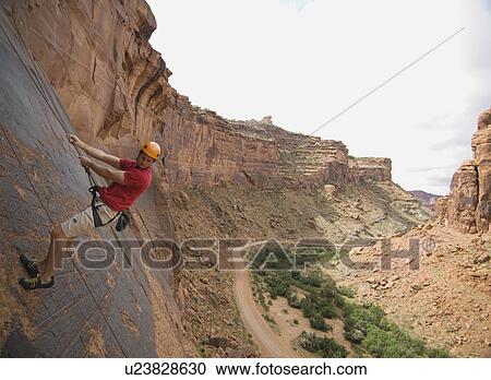 Man rock climbing View Large Photo Image Stock Image - Man rock climbing. Fotosearch