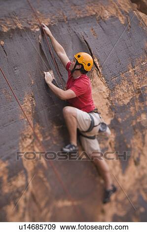 Man rock climbing View Large Photo Image Stock Photo - Man rock climbing. Fotosearch