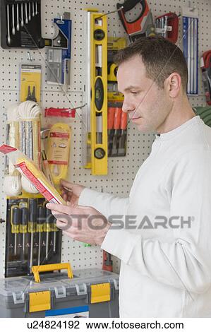Man shopping at hardware store View Large Photo Image Stock Image - Man shopping at hardware store. Fotosearch