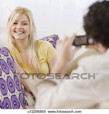 Man taking photograph of girlfriend View Large Photo Image Stock Photography - Man taking photograph of girlfriend. Fotosearch