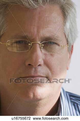 Man wearing eyeglasses View Large Photo Image Stock Image - Man wearing eyeglasses. Fotosearch