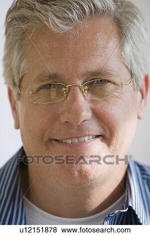 Man wearing eyeglasses View Large Photo Image Stock Photo - Man wearing eyeglasses. Fotosearch