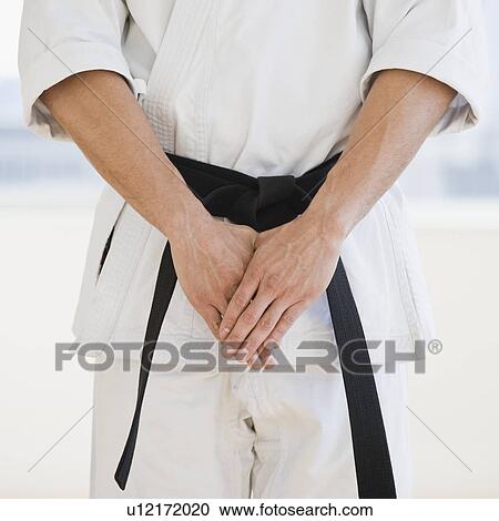 Man wearing karate black belt View Large Photo Image Stock Image - Man wearing karate black belt. Fotosearch