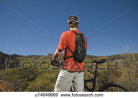 Man with mountain bike, Utah, United States View Large Photo Image Stock Photo - Man with mountain bike, Utah, United States. Fotosearch