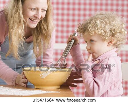 Mother and child cooking View Large Photo Image Picture - Mother and child cooking. Fotosearch