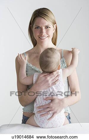Picture - Mother with baby. Fotosearch