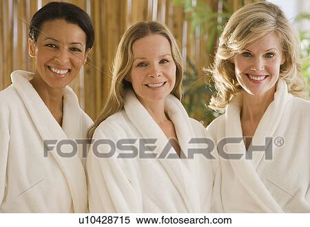 Stock Photography - Multi-ethnic woman wearing bathrobes. Fotosearch
