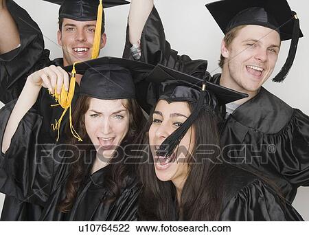 Stock Image - New graduates cheering. Fotosearch