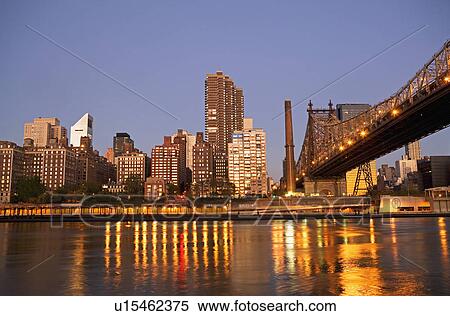 New York City skyline and bridge at night View Large Photo Image Stock Photography - New York City skyline and bridge at night. Fotosearch