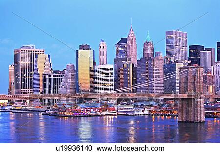 New York City skyline and Brooklyn bridge at dusk View Large Photo Image Stock Image - New York City skyline and Brooklyn bridge at dusk. Fotosearch