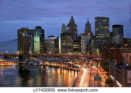 New York City skyline and Brooklyn Bridge at night View Large Photo Image Stock Photography - New York City skyline and Brooklyn Bridge at night. Fotosearch