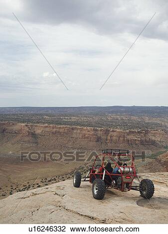 People in off-road vehicle at edge of cliff View Large Photo Image Stock Image - People in off-road vehicle at edge of cliff. Fotosearch
