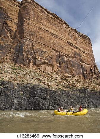 People in raft under cliff View Large Photo Image Stock Photograph - People in raft under cliff. Fotosearch
