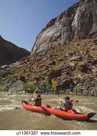 People paddling in raft View Large Photo Image Stock Photo - People paddling in raft. Fotosearch
