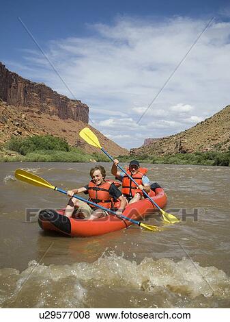 People paddling in raft View Large Photo Image Stock Photo - People paddling in raft. Fotosearch