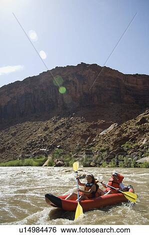 People paddling in raft View Large Photo Image Stock Photograph - People paddling in raft. Fotosearch