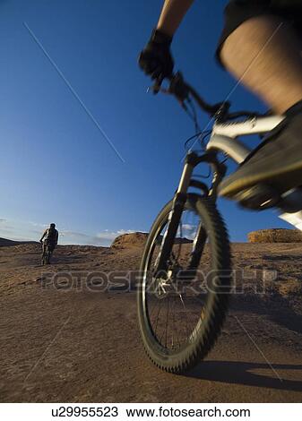 People riding mountain bikes View Large Photo Image Stock Image - People riding mountain bikes. Fotosearch