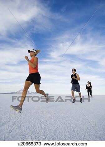 People running on salt flats, Utah, United States View Large Photo Image Stock Image - People running on salt flats, Utah, United States. Fotosearch