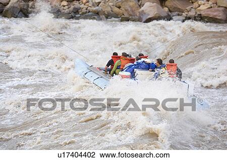 Stock Image - People white water rafting, Colorado River, Moab, Utah, United States. Fotosearch