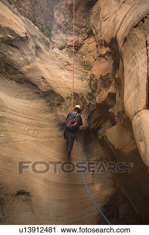 Person canyon rappelling View Large Photo Image Stock Image - Person canyon rappelling. Fotosearch