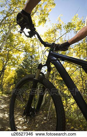 Stock Photograph - Person riding mountain bike, Utah, United States. Fotosearch