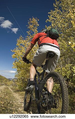 Person riding mountain bike, Utah, United States View Large Photo Image Stock Photography - Person riding mountain bike, Utah, United States. Fotosearch