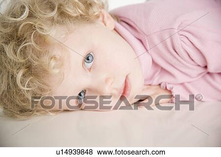 Portrait of a young girl View Large Photo Image Stock Photo - Portrait of a young girl. Fotosearch