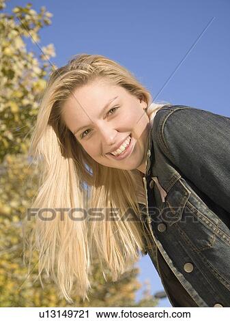 Stock Image - Portrait of a young woman . Fotosearch