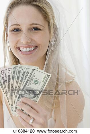 Portrait of bride holding money View Large Photo Image Stock Image - Portrait of bride holding money. Fotosearch