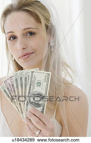 Portrait of bride holding money View Large Photo Image Stock Photo - Portrait of bride holding money. Fotosearch