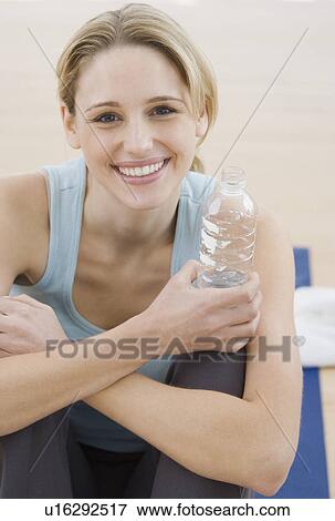 Portrait of woman in athletic gear View Large Photo Image Stock Photo - Portrait of woman in athletic gear. Fotosearch