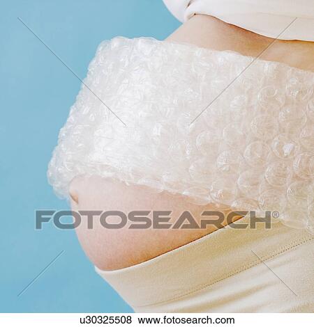 Pregnant woman’s belly wrapped in bubble wrap View Large Photo Image Stock Photo - Pregnant woman’s belly wrapped in bubble wrap. Fotosearch