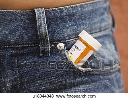 Stock Photo - Prescription bottle sticking out of pants pocket. Fotosearch