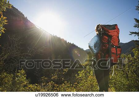 Stock Photograph - Rear view of female hiker, Utah, United States. Fotosearch