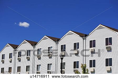 Row houses under blue sky View Large Photo Image Stock Image - Row houses under blue sky. Fotosearch